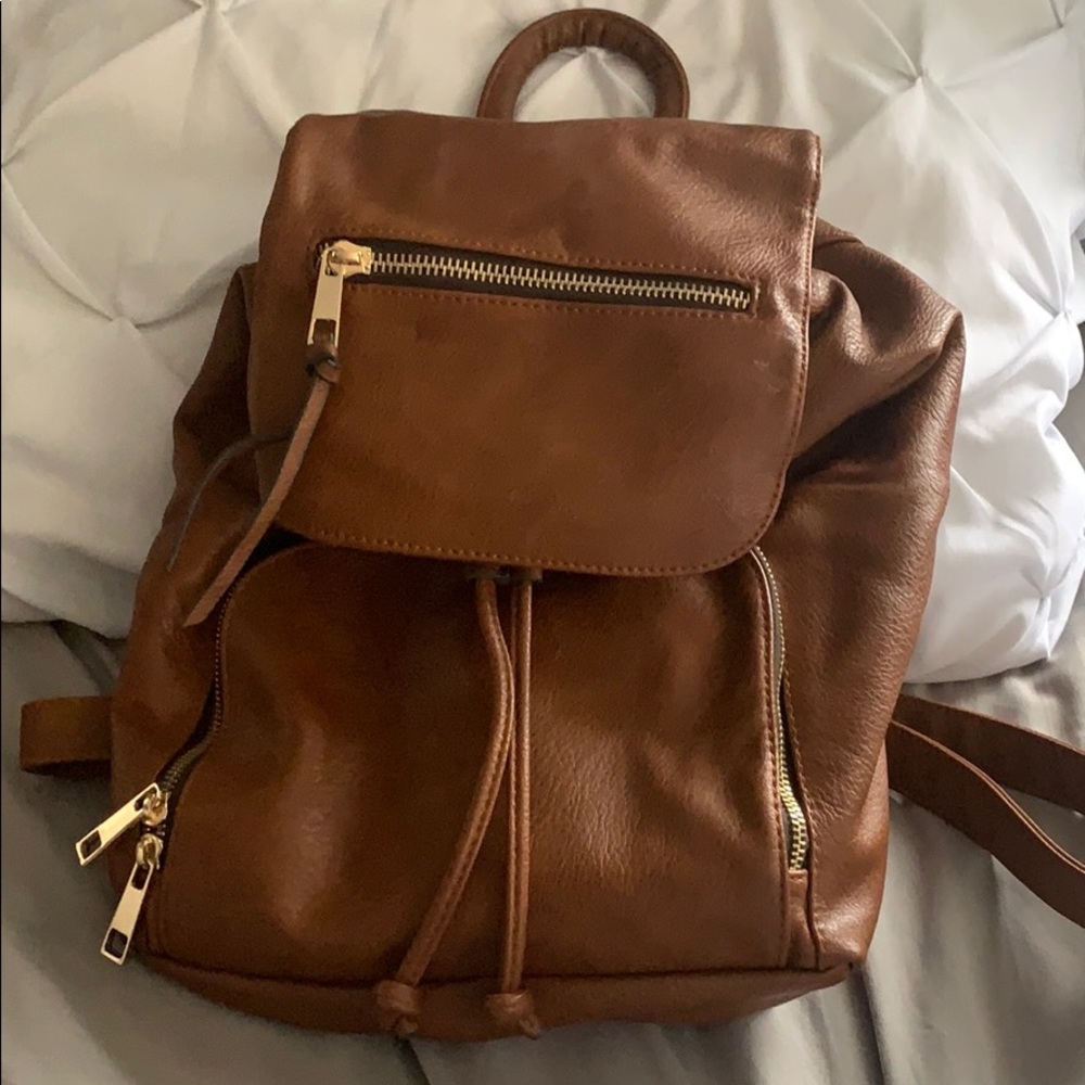 Tan also backpack,perfect condition, gold hardware